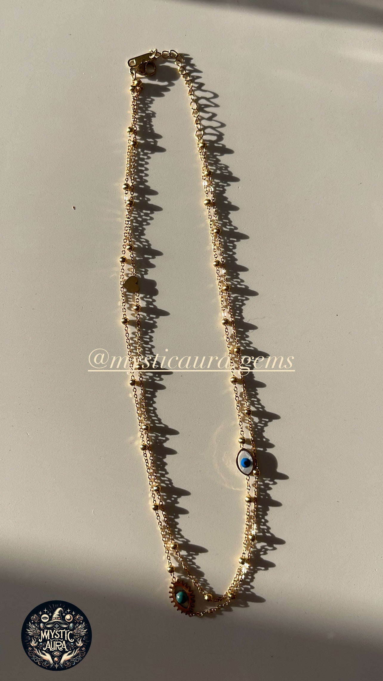 🧿 Collier double chaîne – Œil de protection doré